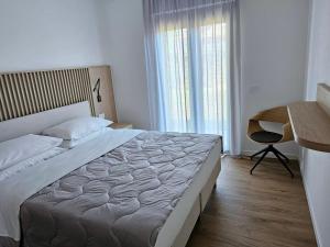 Postel nebo postele na pokoji v ubytování Appartamenti Mare Azzurro