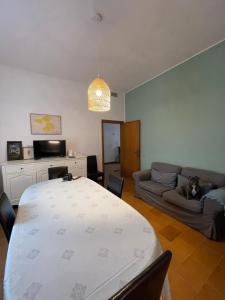 a living room with a table and a couch at The Tuscany Rose in Pistoia