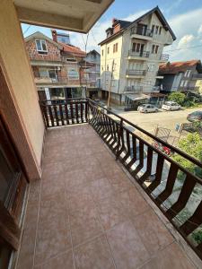 a balcony with a view of a street and buildings at Lea Apartment in Struga