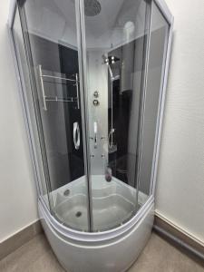 a shower with a glass enclosure in a bathroom at Casa Elena in Eforie Sud +33 photos