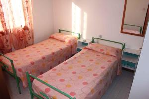 Posteľ alebo postele v izbe v ubytovaní Apartment in Rosolina Mare 25073