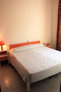 Posteľ alebo postele v izbe v ubytovaní Apartment in Rosolina Mare 25073