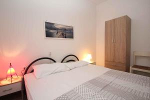 Posteľ alebo postele v izbe v ubytovaní Apartment in Rosolina Mare 25073