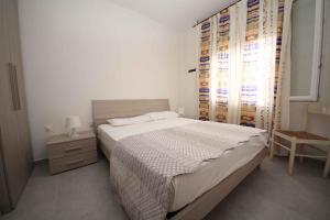 Posteľ alebo postele v izbe v ubytovaní Apartment in Rosolina Mare 25073