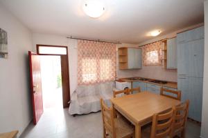 Kuchyňa alebo kuchynka v ubytovaní Apartment in Rosolina Mare 25073