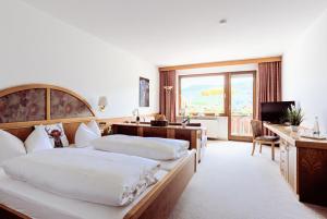 Postel nebo postele na pokoji v ubytování Hotel Schauinsland