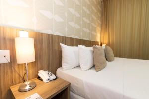 Postel nebo postele na pokoji v ubytování Mais Hotel Aeroporto Salvador