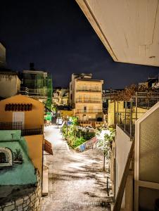 a view of an empty city street at night at Herakleion center single room in Bendevís