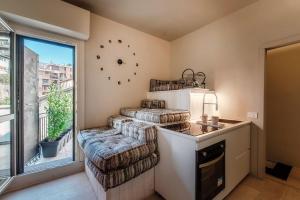 a living room with a chair and a window at Villa Miranda Luxury Como Lake View Penthouse with Panoramic Terrace in Como