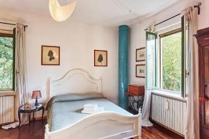 Postel nebo postele na pokoji v ubytování B&B Due Fiumi 1908