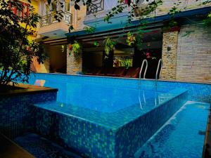 a swimming pool in the middle of a building at Hotel Middle Path & Spa in Pokhara