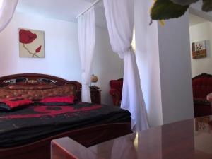 Postel nebo postele na pokoji v ubytování Complex Gec Histria Mamaia