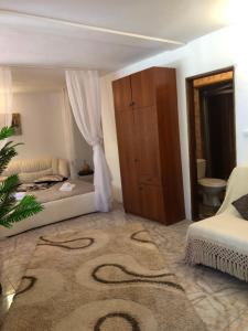 Postel nebo postele na pokoji v ubytování Complex Gec Histria Mamaia