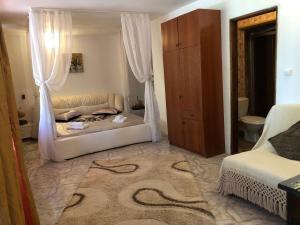 Postel nebo postele na pokoji v ubytování Complex Gec Histria Mamaia