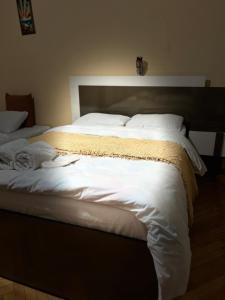 Postel nebo postele na pokoji v ubytování Hotel Kiwi Garden