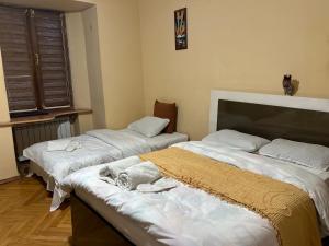 Postel nebo postele na pokoji v ubytování Hotel Kiwi Garden