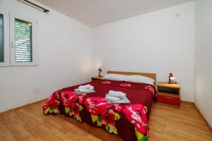 Postel nebo postele na pokoji v ubytování Apartments Tasa