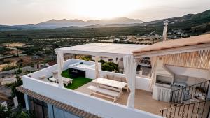 a view from the balcony of a house at Evnia Sunset Crete Escape, Private HotTub Retreat in Rotásion +33 photos