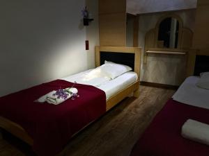 Postel nebo postele na pokoji v ubytování Hotel Kiwi Garden