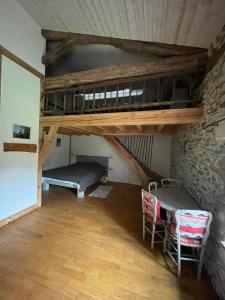 Ένα ή περισσότερα κρεβάτια σε δωμάτιο στο Maison d'hôtes la Passemarié