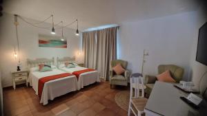 Katil atau katil-katil dalam bilik di Hotel Los Olivos