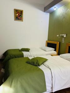 Postel nebo postele na pokoji v ubytování Hotel Kiwi Garden