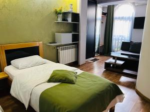 Postel nebo postele na pokoji v ubytování Hotel Kiwi Garden