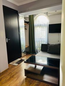 TV a/nebo společenská místnost v ubytování Hotel Kiwi Garden