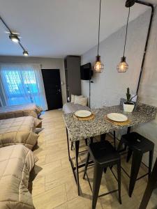 a living room with a table and a couch at Monoambiente Espacio super funcional in Guaymallen