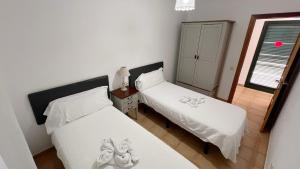 En eller flere senge i et værelse på Anahi Homes Corralejo- Bicacarera 3