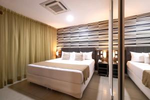Postel nebo postele na pokoji v ubytování Mais Hotel Aeroporto Salvador