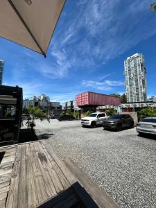 a parking lot with cars parked in a city at Nomada Republic Hotel Panama City in Panama City