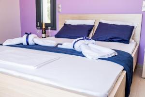 Posteľ alebo postele v izbe v ubytovaní Golden Sun Villas