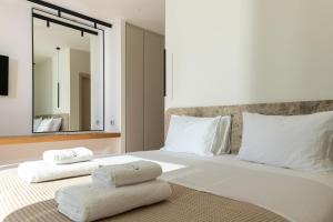 Postel nebo postele na pokoji v ubytování Seanatra Luxury Villas
