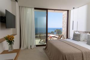 Postel nebo postele na pokoji v ubytování Seanatra Luxury Villas
