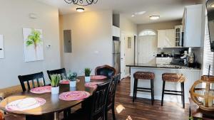 a dining room and kitchen with a table and chairs at Beautiful duplex in Murrells Inlet B in Myrtle Beach