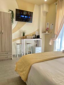 A bed or beds in a room at Terrazza Garibaldi