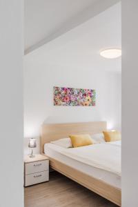 Ένα ή περισσότερα κρεβάτια σε δωμάτιο στο Apartments Wojcicky