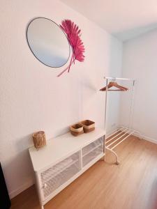a white room with a mirror on the wall at Ch'ti Lillois - Appartement 3 personnes Lille in Lille