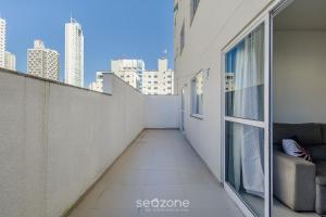 a balcony with a view of the city at Apt c/ Churrasq. a 600m da Praia GEN0102 in Balneário Camboriú
