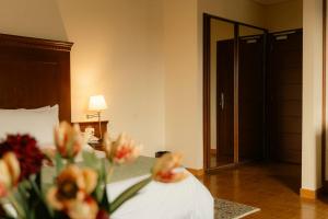 Postel nebo postele na pokoji v ubytování Le Cedrus Hotel