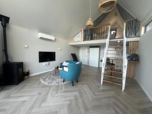 TV a/nebo společenská místnost v ubytování Studio Lakeview