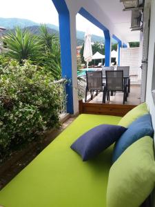 a balcony with a bed and a table on a patio at Villa Riviera in Stavros