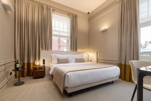 Ένα ή περισσότερα κρεβάτια σε δωμάτιο στο LUBICH Concept Hotel +81 φωτογραφίες