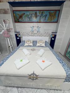 Ένα ή περισσότερα κρεβάτια σε δωμάτιο στο Il Veliero Bianco