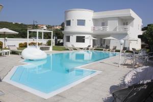 a swimming pool in front of a house at Al Mare da Francesca in Olbia