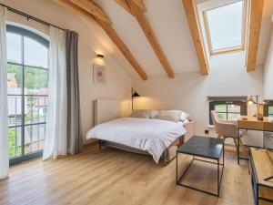 Katil atau katil-katil dalam bilik di Apartment Luxury Mountain Attic by Interhome