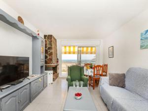 a living room with a couch and a table at Apartment Bahia by Interhome in Cunit