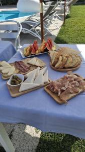 a table with different types of food on it at Al Mare da Francesca in Olbia