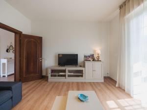 a living room with a tv and a couch at Apartment Titta by Interhome in Casarza Ligure +37 photos